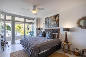 Postel nebo postele na pokoji v ubytování 2 Sun Center