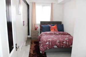 a bedroom with a bed and a window at Bowery Apartment - 2 Bedrooms 1st floor in Dagenham