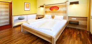 Postel nebo postele na pokoji v ubytování Revita Hotel Kocher