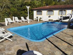 A piscina localizada em Pousada 3 Corações Penedo ou nos arredores