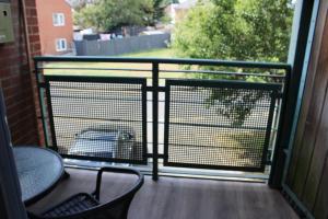 a screened in porch with a view of a yard at Bowery Apartment - 2 Bedrooms 1st floor in Dagenham