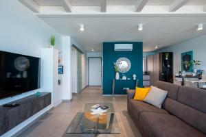 Posedenie v ubytovaní "I MORI LUXORY APARTMENTS" - Attico mansardato con incantevole vista mare