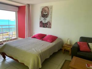 Postel nebo postele na pokoji v ubytování Studio Marigot, Vue Panoramique