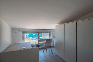 Kuchyňa alebo kuchynka v ubytovaní "I MORI LUXORY APARTMENTS" - Attico mansardato con incantevole vista mare