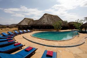 a resort with lounge chairs and a swimming pool at Samburu Sopa Lodge in Archers Post