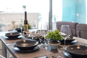 Nápoje v ubytovaní "I MORI LUXORY APARTMENTS" - Attico mansardato con incantevole vista mare