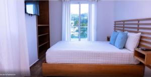 Postelja oz. postelje v sobi nastanitve Samaná Suites Hotel by Habita