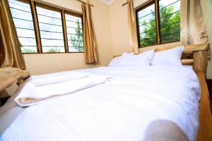 Postel nebo postele na pokoji v ubytování Teryet Safari Lodge