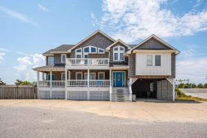 a large house with a large front porch at SH450 Sea You Soon in Southern Shores