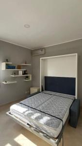 a bedroom with a bed in a room at Casa Colò in Naples