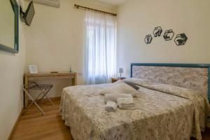 Postel nebo postele na pokoji v ubytování Tana del Cinghiale