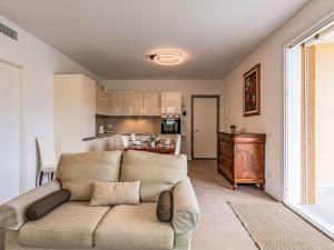 a living room with a couch and a kitchen at Apartment Luna by Interhome in Gravedona +26 photos