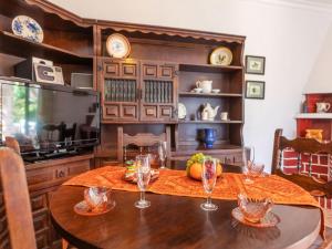 a dining room with a table with wine glasses on it at Holiday Home Omega by Interhome in L'Ametlla de Mar