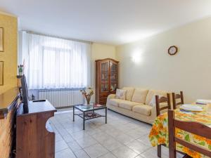 a living room with a couch and a table at Holiday Home Girasole by Interhome in Corrido