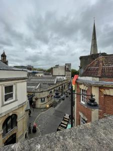 an overhead view of a city with buildings and a church at Super Central Apartment in Heart of the City in Bristol