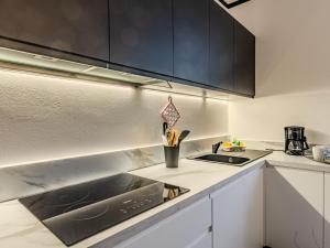a kitchen with a sink and a counter top at Apartment Nonna Grazia by Interhome in Lenno