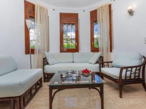 a living room with two couches and a coffee table at Holiday Home Avellaner by Interhome in Miami Platja
