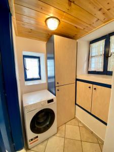a washer and dryer in a tiny house at Lena & Louis in Andros