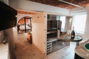 a room with a large wooden cabinet with a table at Luxury Residence Metlika in Metlika
