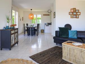 a living room with a couch and a table at Villa Route de la Muraz 9 by Interhome in Villeneuve