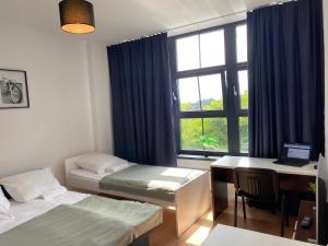 Posteľ alebo postele v izbe v ubytovaní SleepWell Apartments