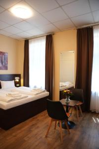 Postel nebo postele na pokoji v ubytování Hotel CityRing