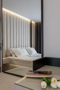 Postel nebo postele na pokoji v ubytování AMI MAR Hotel