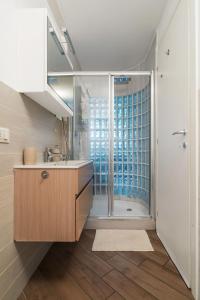 a bathroom with a sink and a shower at Glass Loft in Milan
