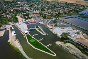 an aerial view of a marina with boats in the water at Apartament Luna in Jurilovca