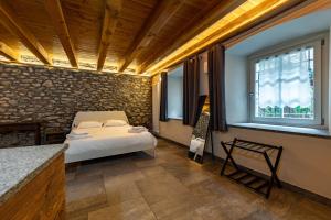 Posteľ alebo postele v izbe v ubytovaní Inn Aosta Apartments