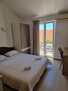 Postel nebo postele na pokoji v ubytování Guest House Damjana