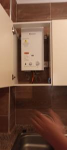 a projection screen in a kitchen with a sink at Nour 2 in Oued Laou +76 photos