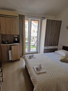 Postel nebo postele na pokoji v ubytování Guest House Damjana