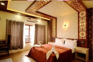 a bedroom with a large bed with a large mirror at Northstar 5 Bedroom Ac Private Houseboat With All Meals in Alleppey