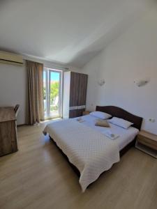 Postel nebo postele na pokoji v ubytování Guest House Damjana