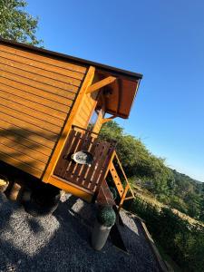 a tiny house sitting on top of a table at La Rouloulotte in Durbuy