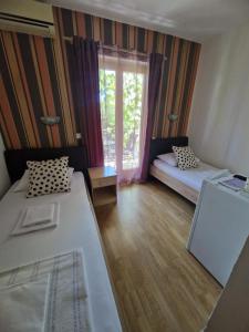 Postel nebo postele na pokoji v ubytování Guest House Damjana
