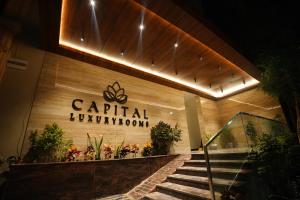 a building with a sign that reads capital luxurypotion at Capital Luxury Suites in Vijayawāda