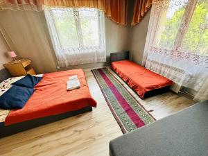 Posteľ alebo postele v izbe v ubytovaní Domek nad Potokiem