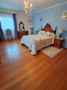 Postel nebo postele na pokoji v ubytování Casa dos Encantos