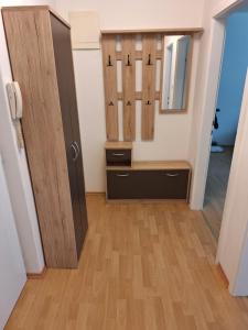 a dressing room with a door and a mirror at Apartment Kapfenberg in Kapfenberg +10 photos