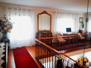 TV a/nebo společenská místnost v ubytování Casa dos Encantos