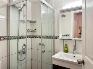 a bathroom with a shower and a sink at Kekik Butik Otel in Çeşme +50 photos