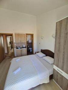 Postel nebo postele na pokoji v ubytování Guest House Damjana