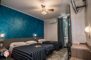 Postel nebo postele na pokoji v ubytování Hotel Bel Sit