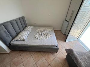 Postel nebo postele na pokoji v ubytování Dina House