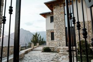 a view of a building from inside a gate at Bujtina KOEL in Gjirokastër
