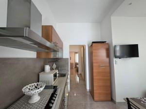 Kuchyň nebo kuchyňský kout v ubytování B&B Primalba