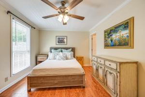 a bedroom with a bed and a ceiling fan at Smith Mountain Lake Cottage with Dock and Fire Pit! in Gladehill