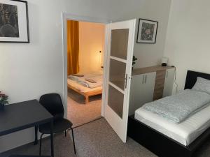 Postel nebo postele na pokoji v ubytování Black Style ROOMS Moravske namesti